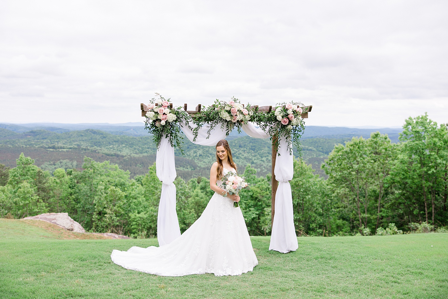 bride portraits under ceremony arch before Romantic Spring Wedding at Weddings at Cabin Bluff