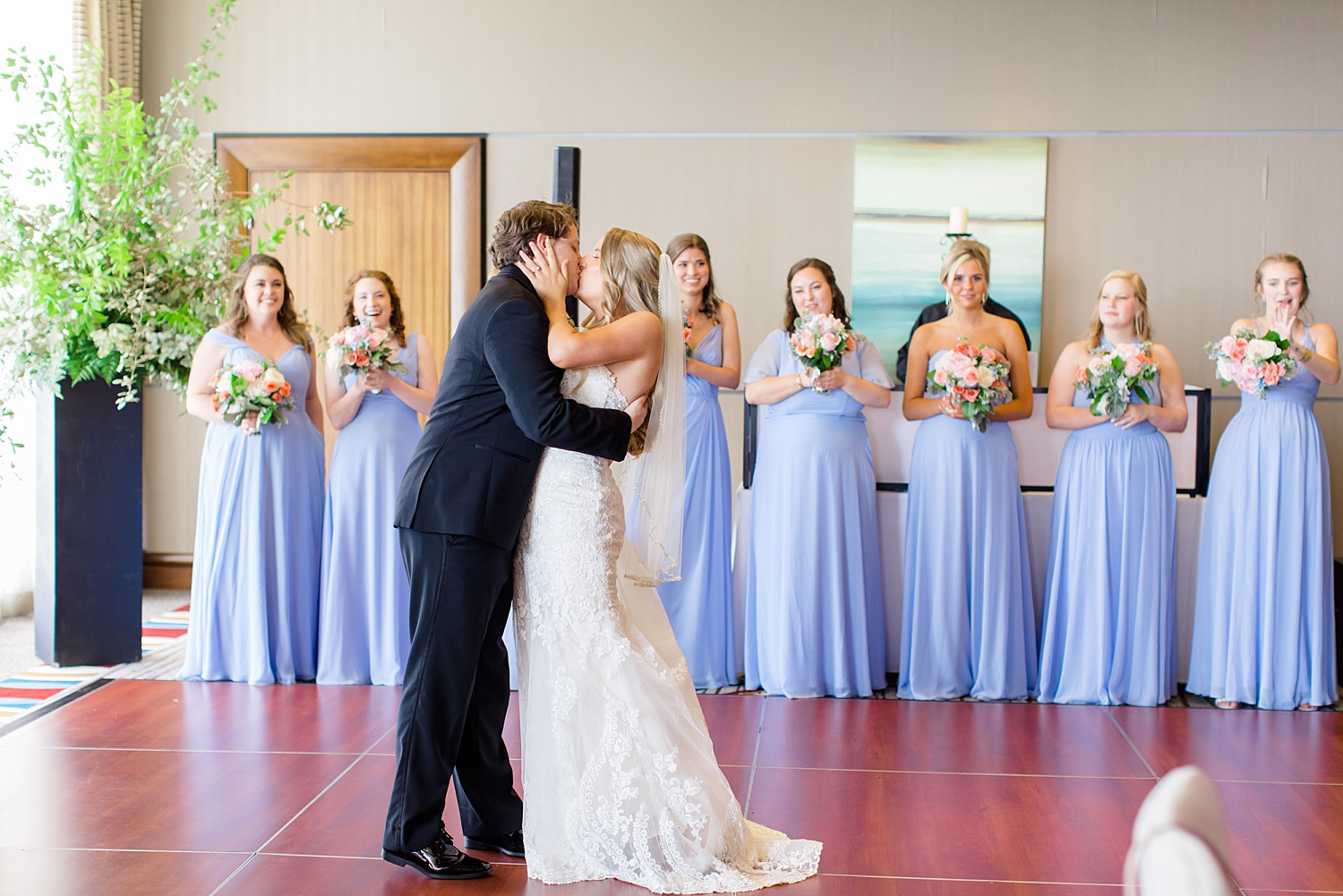 newlyweds on dance floor share a kiss