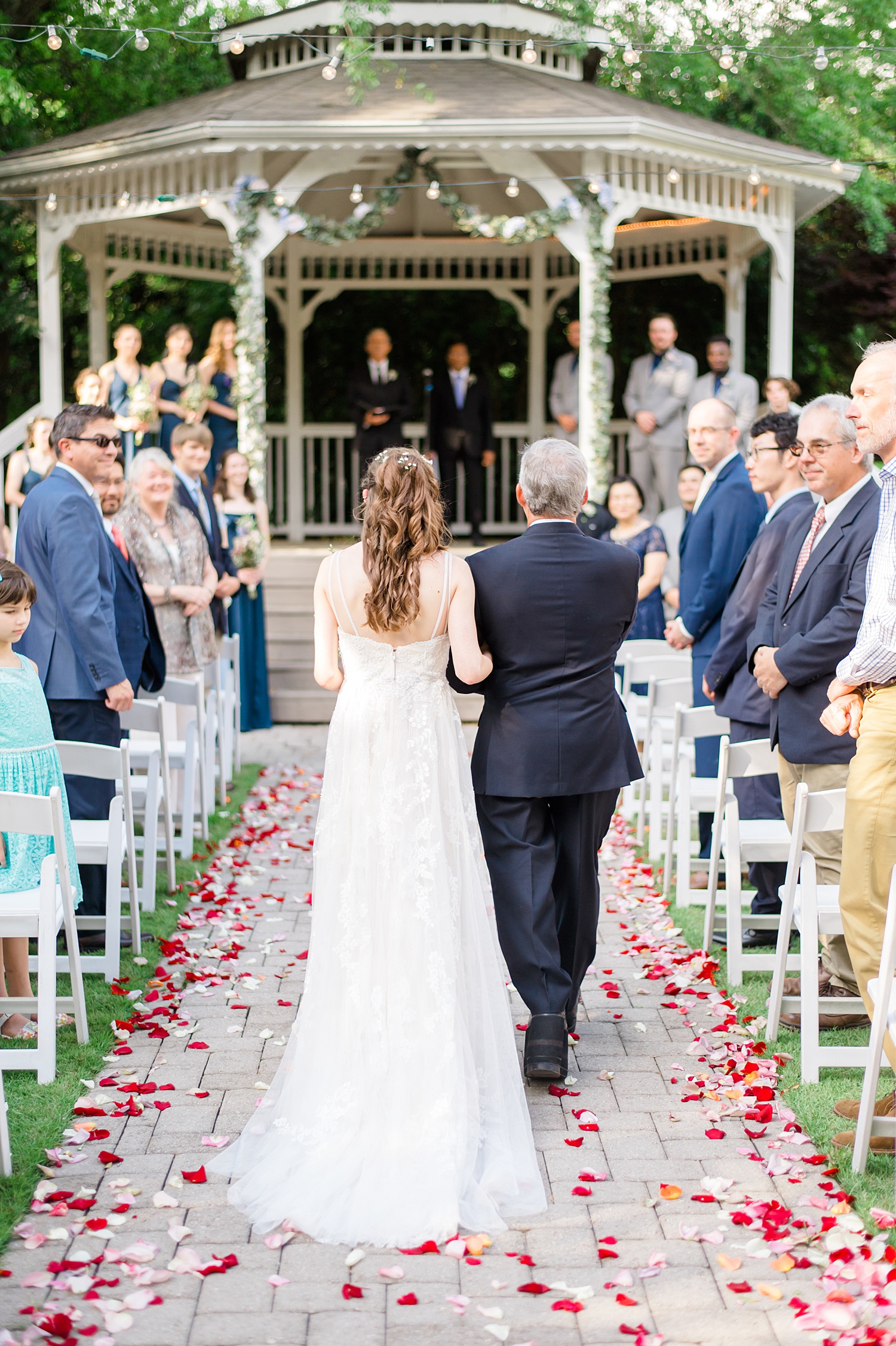 father escorts his daughter down the aisle 