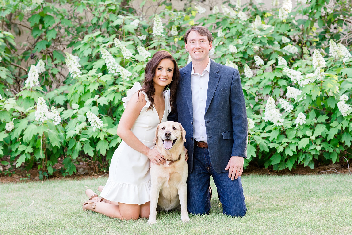 couple with their lab during engagement portraits in downtown Birmingham AL