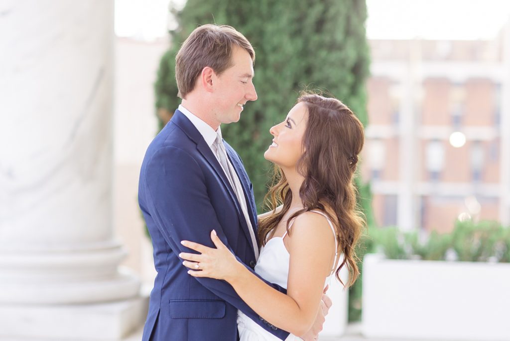 couple looking up at each other during Downtown Birmingham Alabama Summer Engagement Session