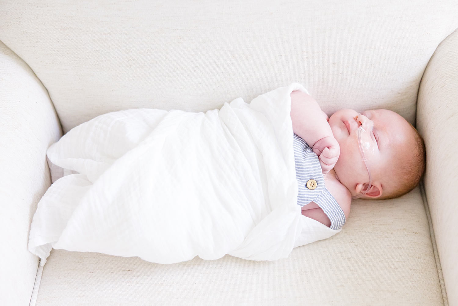 sleeping newborn boy during in-home session 