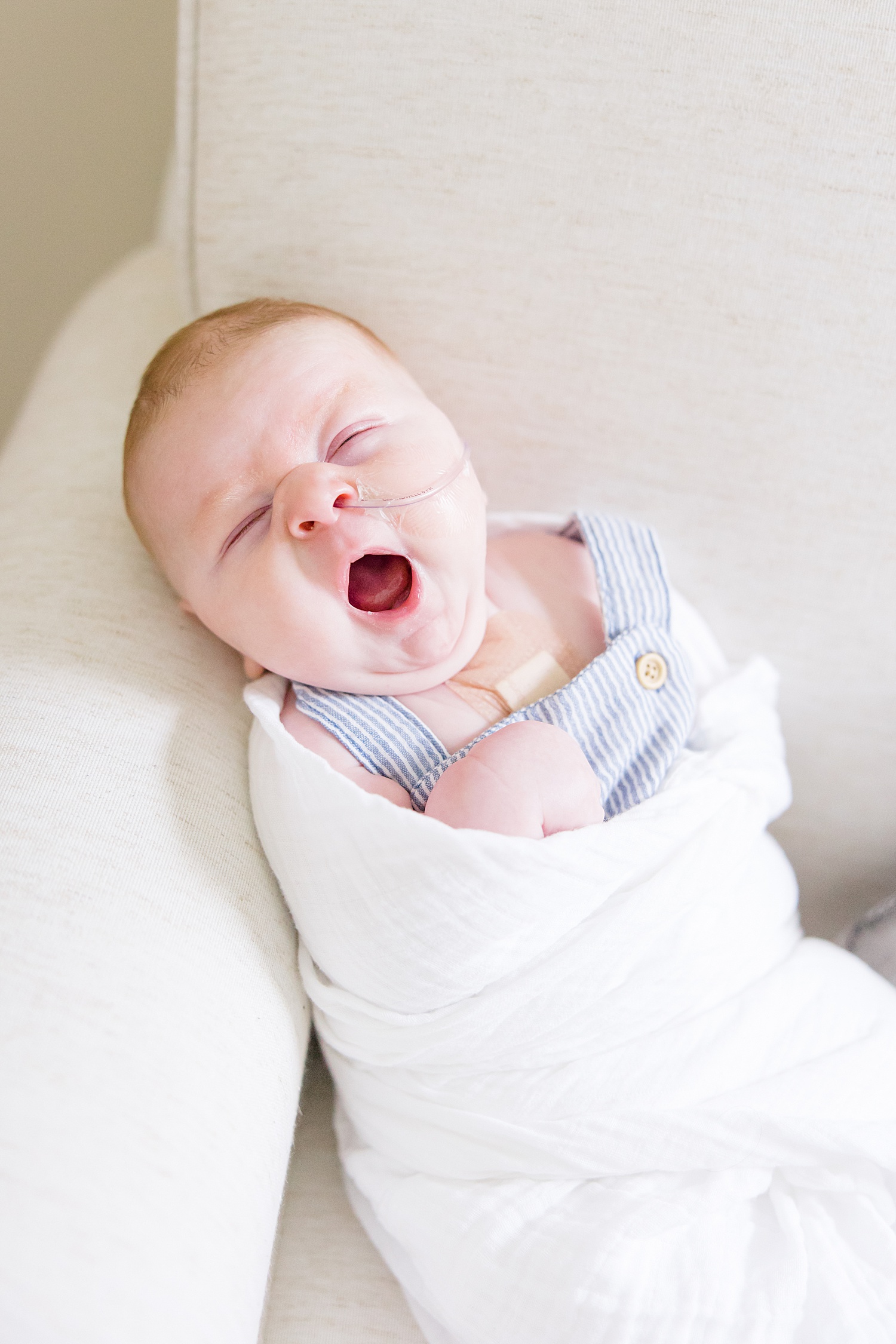 baby boy yawns in his sleep during in-home newborn session in Birmingham AL 