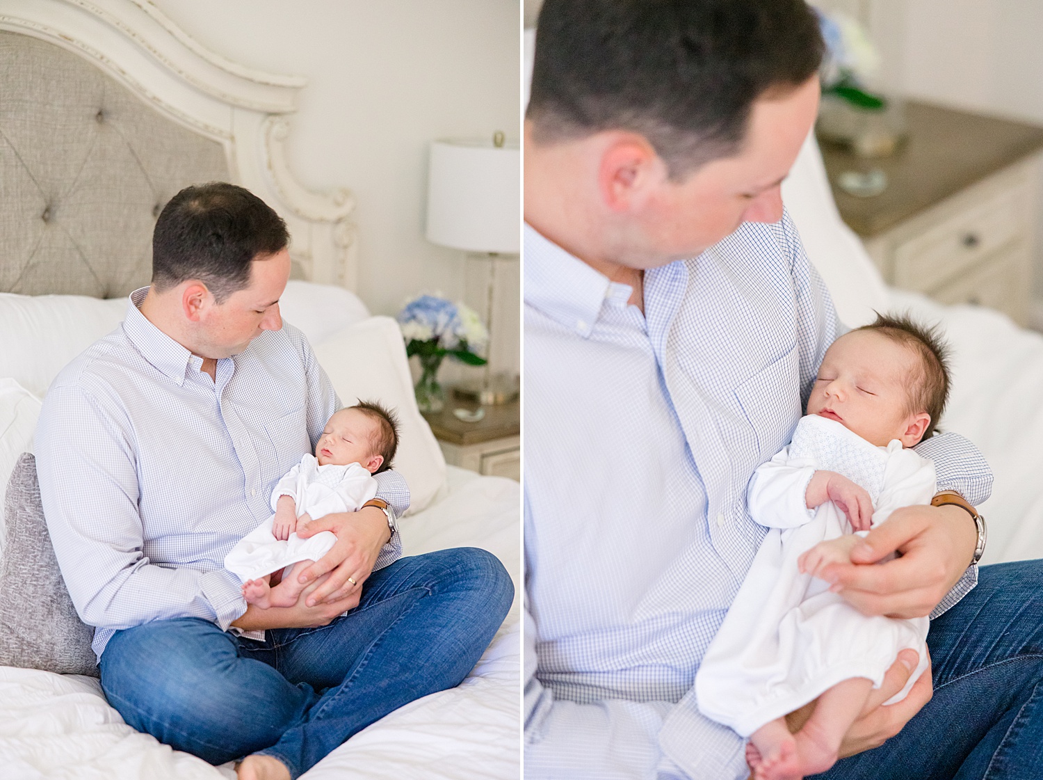 father holds his newborn sitting on bed 