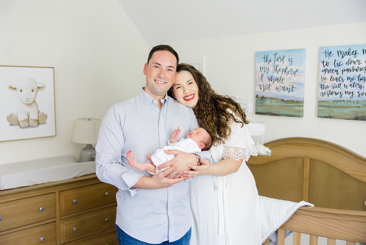 parents hold son in nursery during At-home Newborn + Lifestyle session