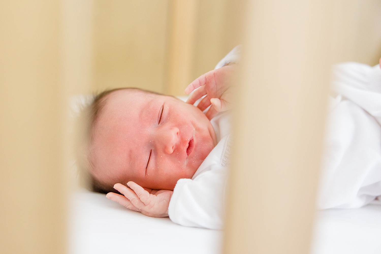 baby boy in crib during At-home Newborn + Lifestyle session