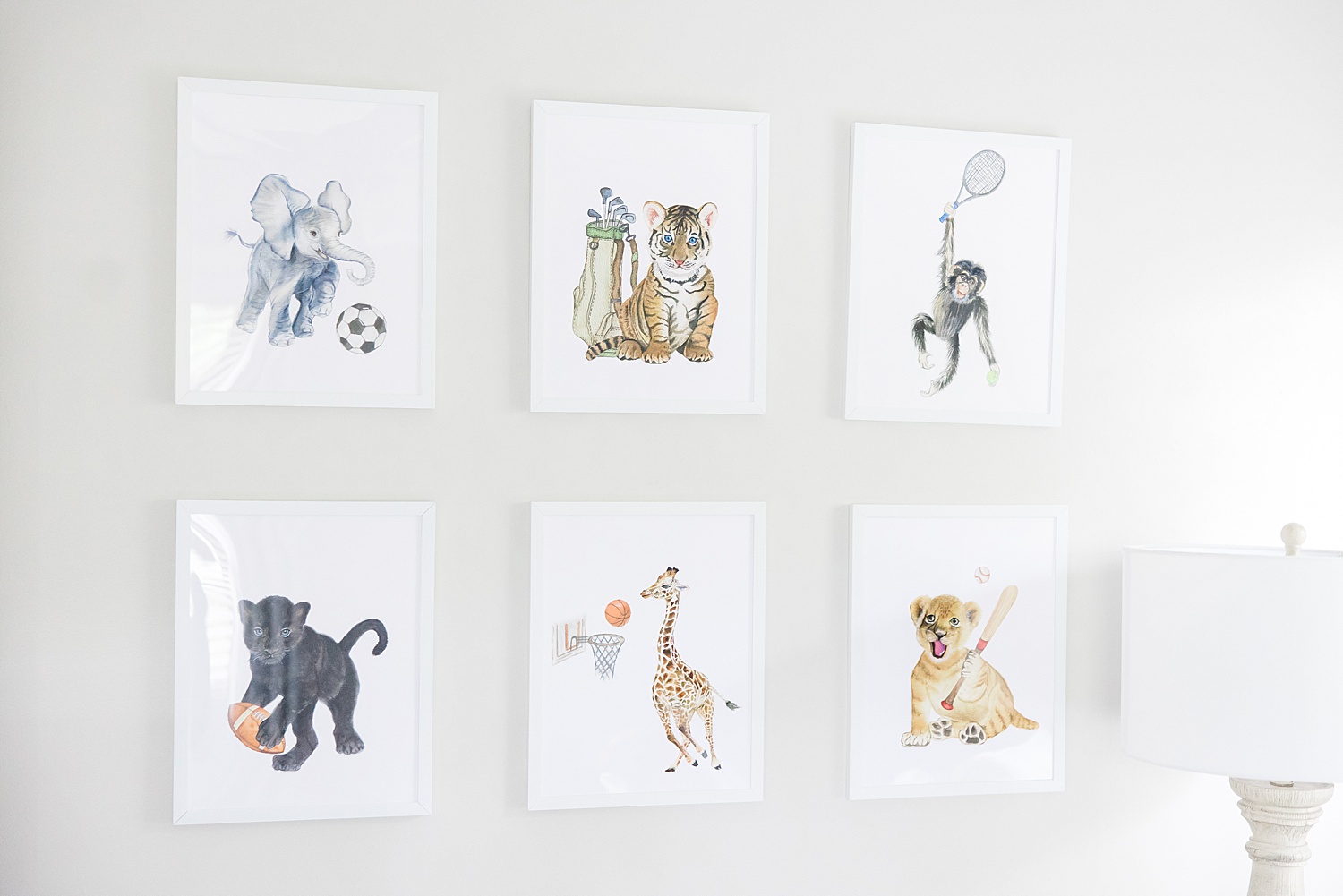 wall art of animals playing sports in baby boy nursery 