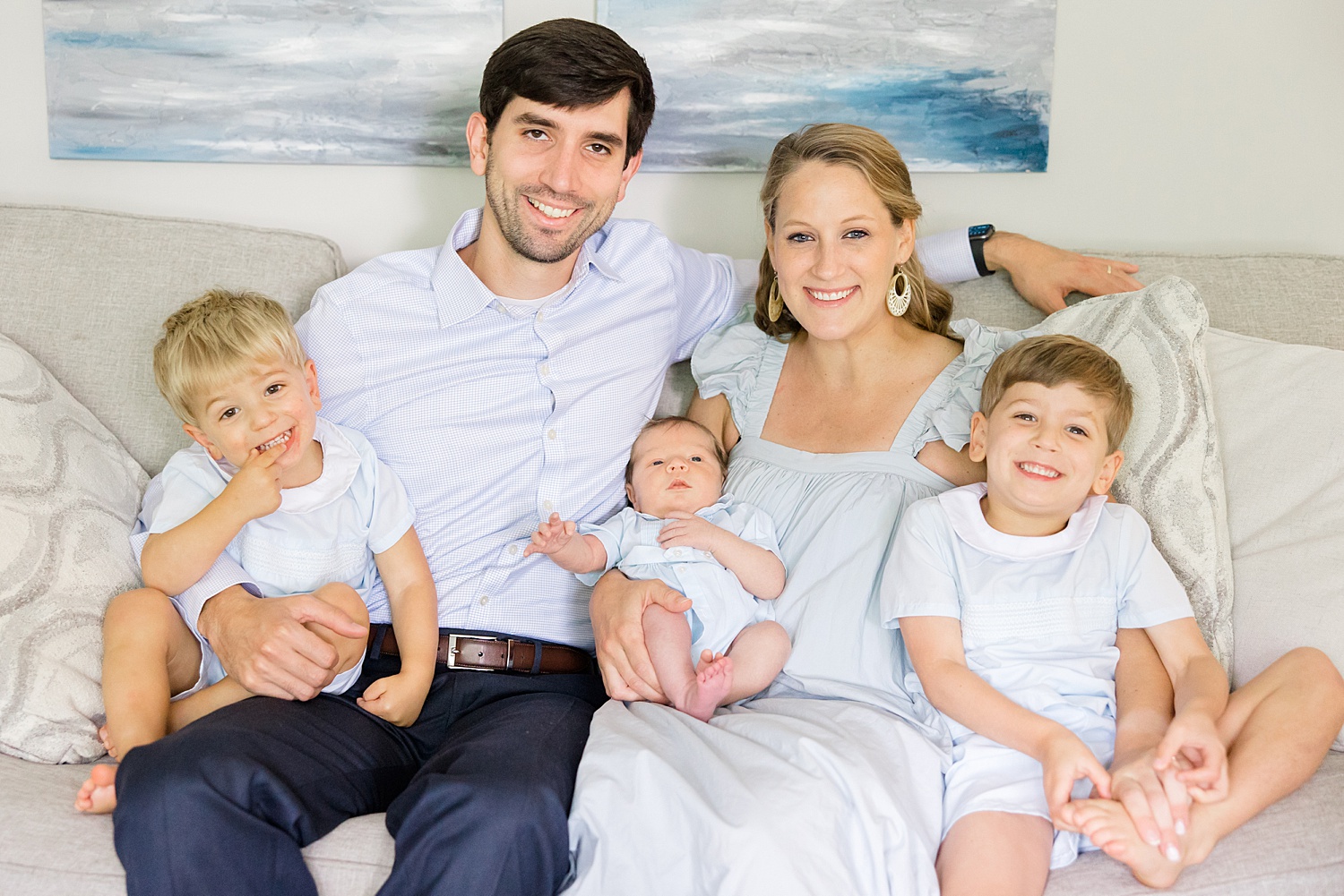 family of five sit on couch during Newborn and Family Milestone Portraits