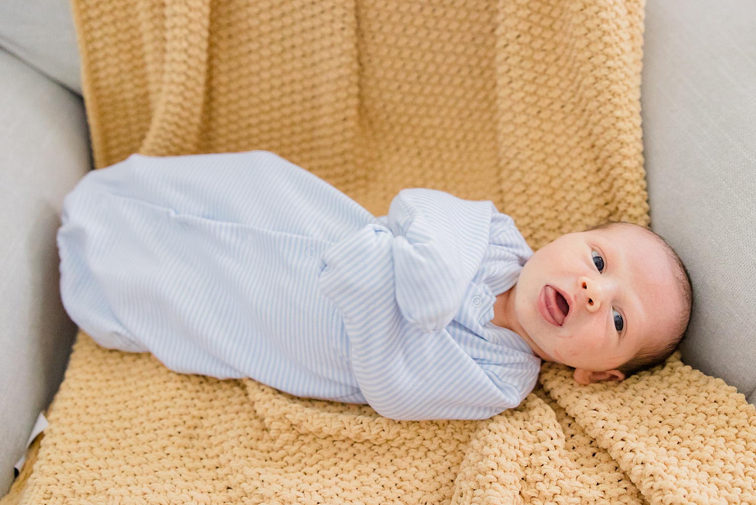 newborn lays in chair during Cozy In-Home Newborn Session