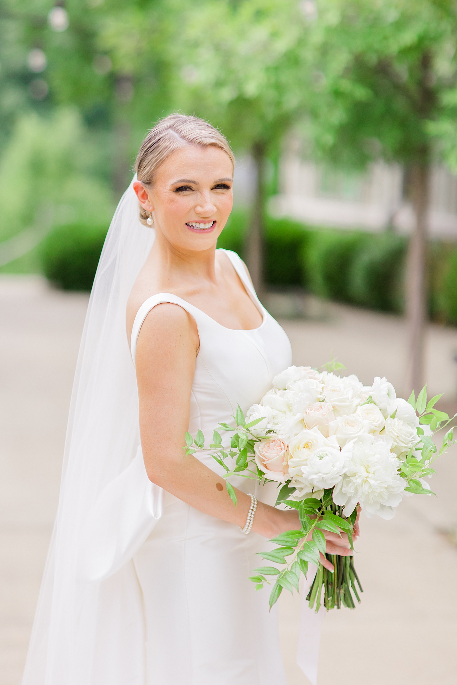 bride holding wedding flower bouquet