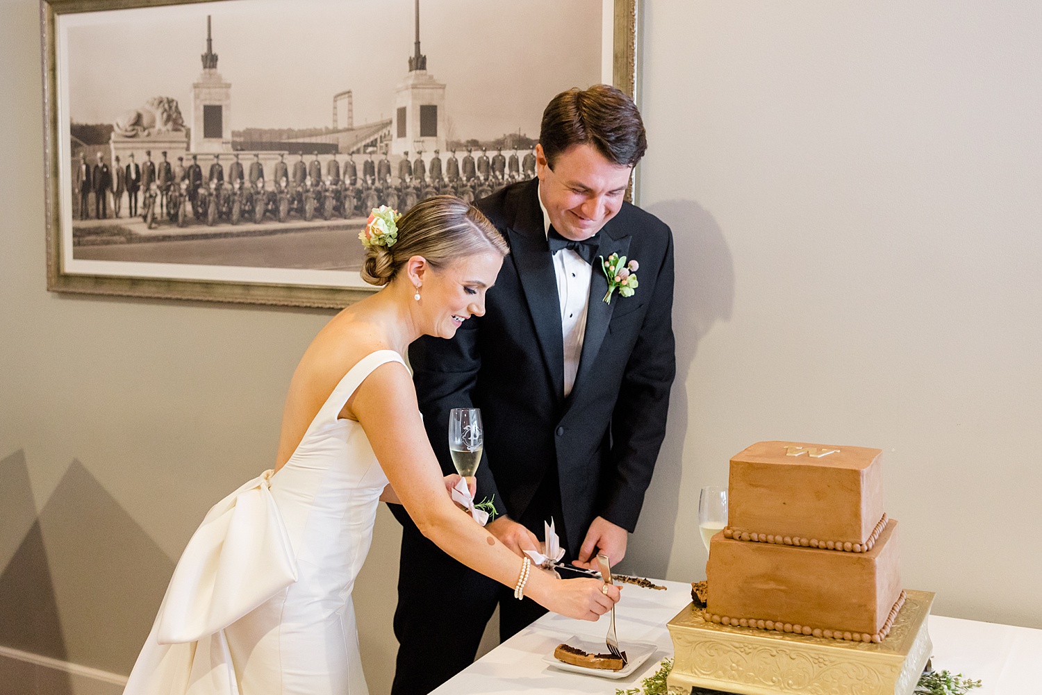 couple cut cake at wedding reception