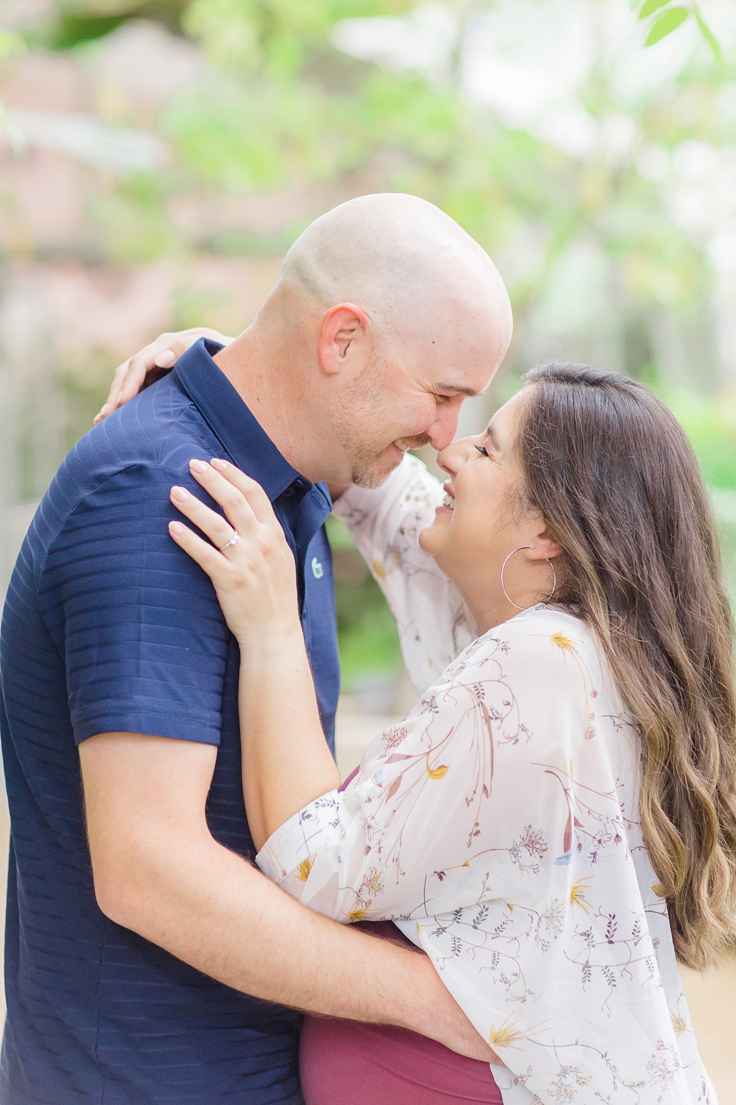 Couple lean in together during their engagement session
