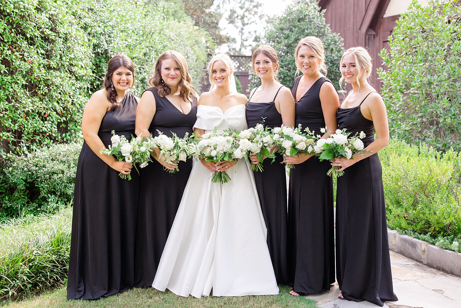 bride and bridesmaids in black dresses before Classic + Romantic Birmingham Wedding 