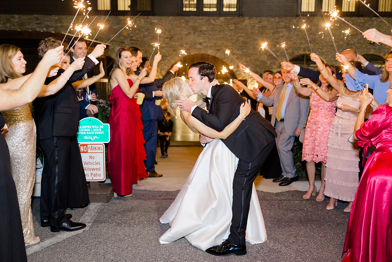 bride and groom kiss during sparkler wedding exit 