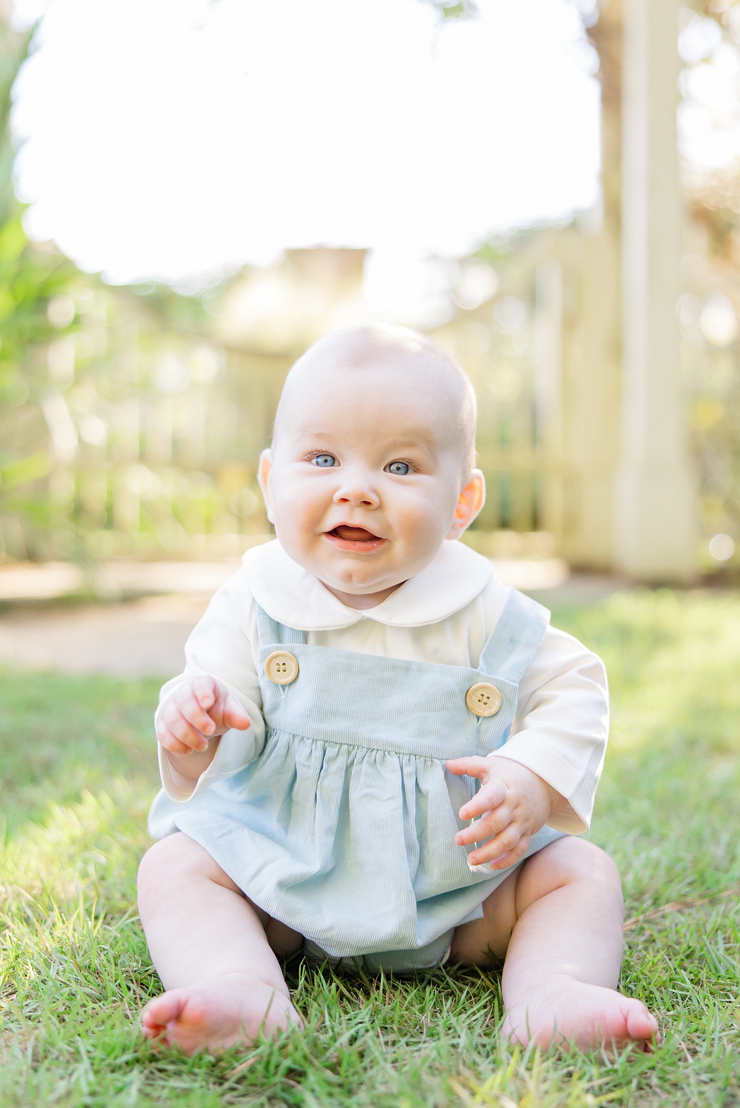 happy boy during 6 month milestone portraits by Birmingham Newborn + Family Photographer