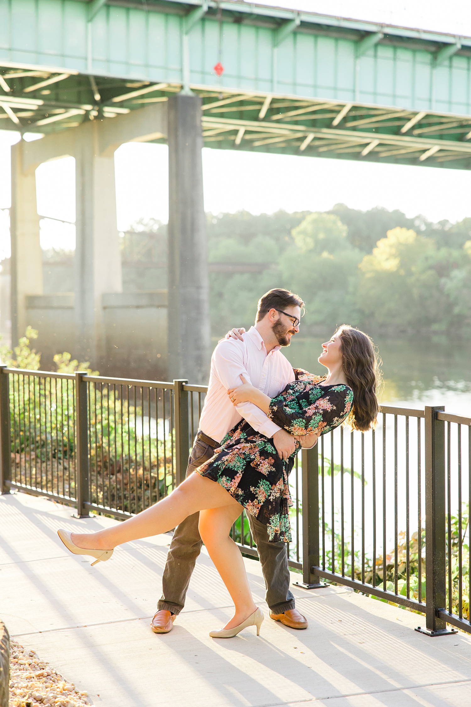 man dips his fiance at Riverwalk in Tuscaloosa, Alabama
