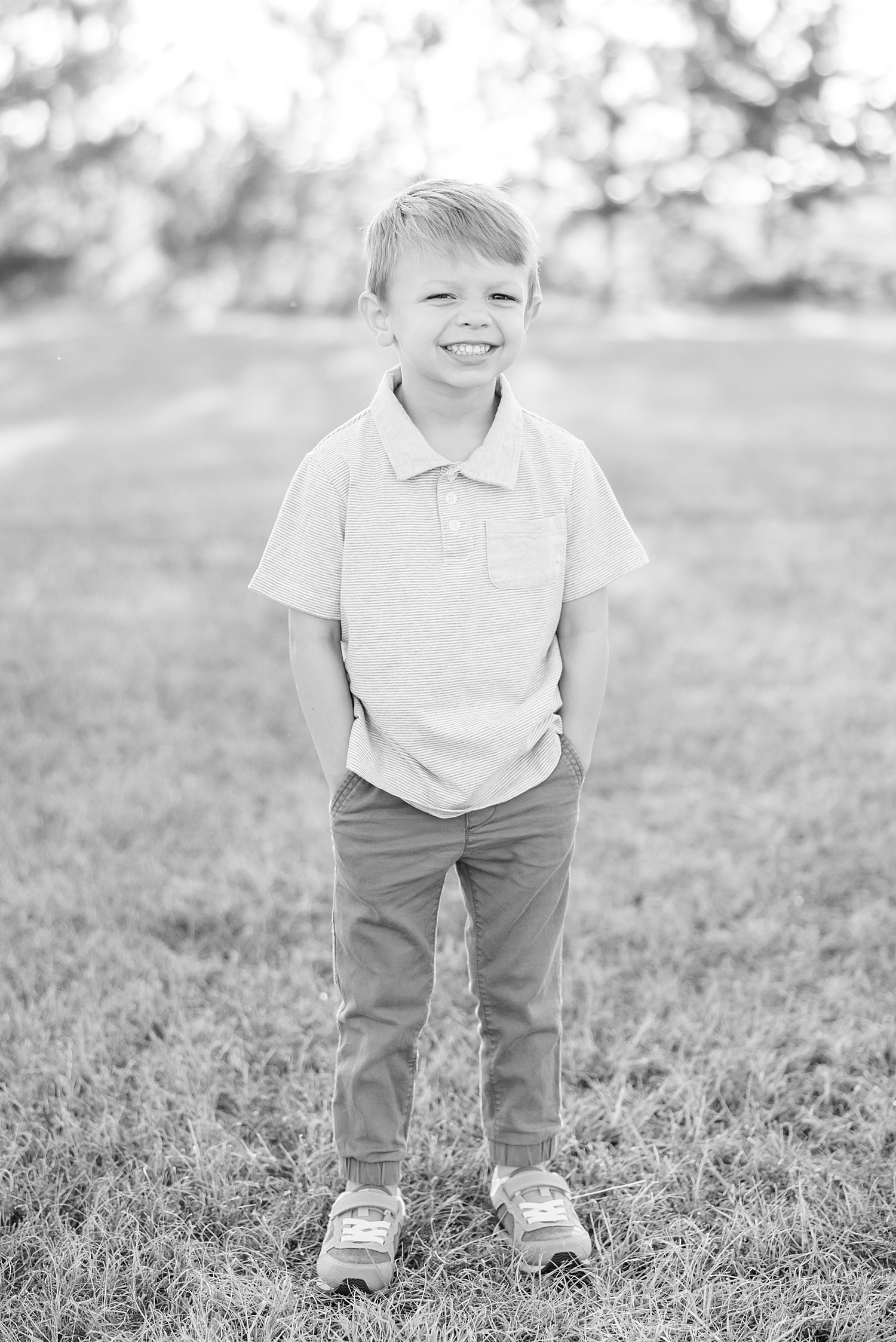 boy stands with hands in pockets during individual portraits