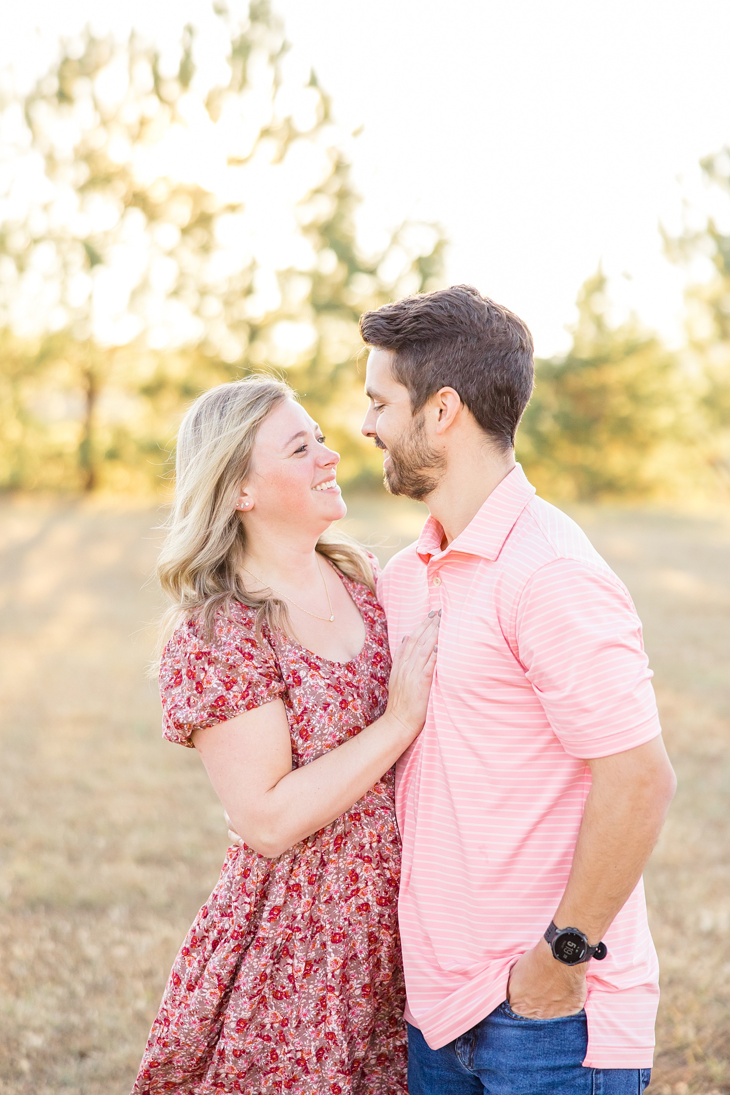 husband and wife look at each other during Birmingham Fall Family Session