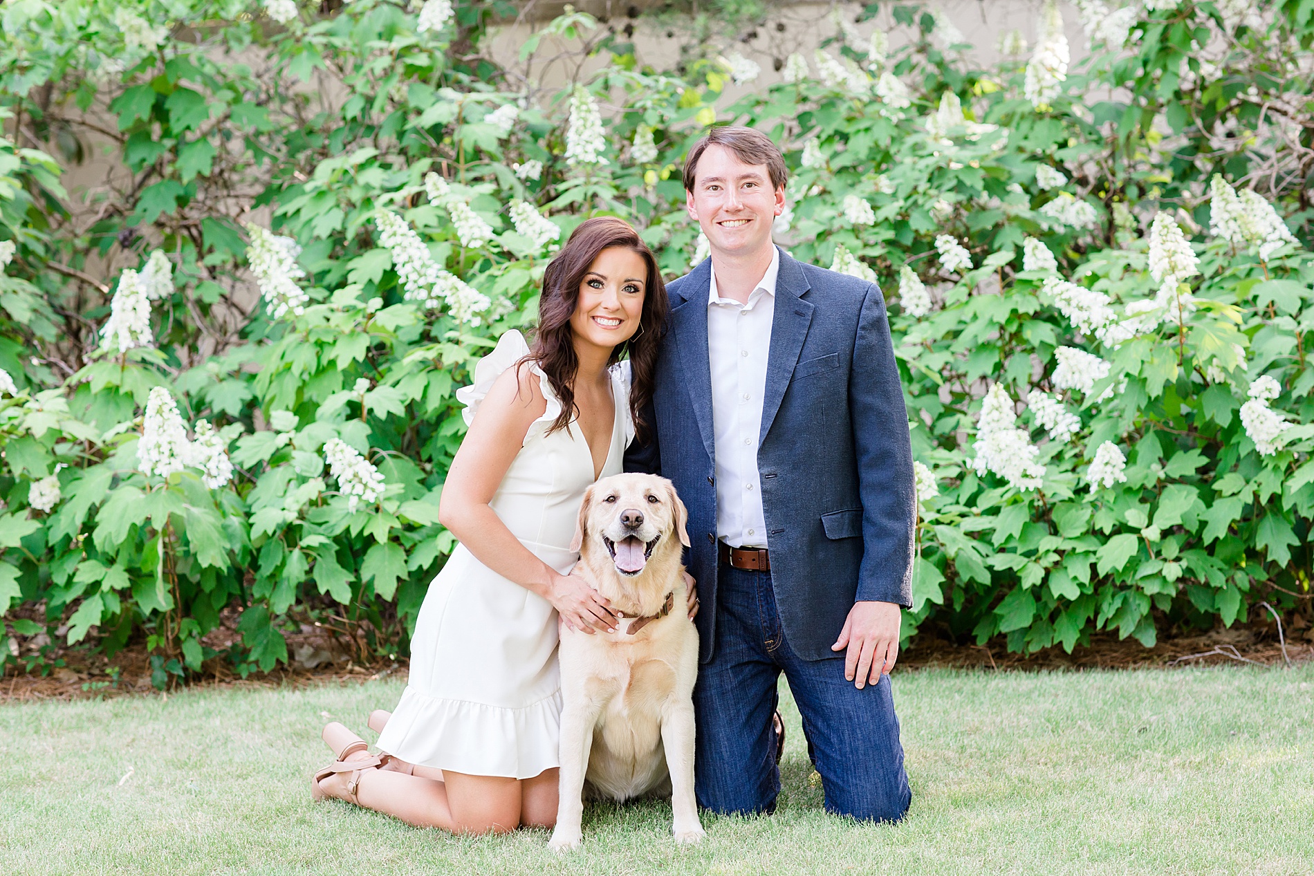 engaged couple with their dog 