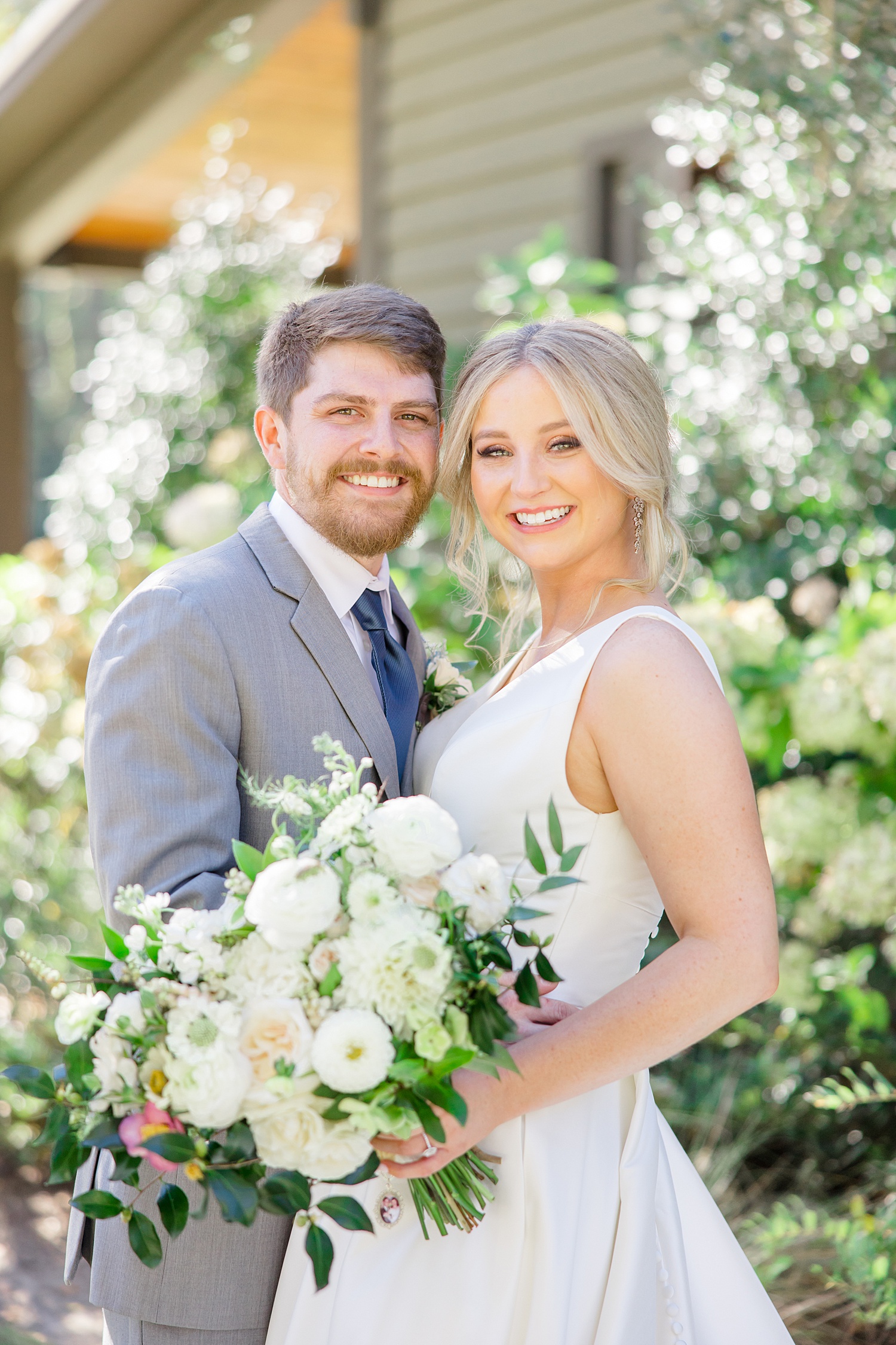 wedding portraits with flowers in the background 