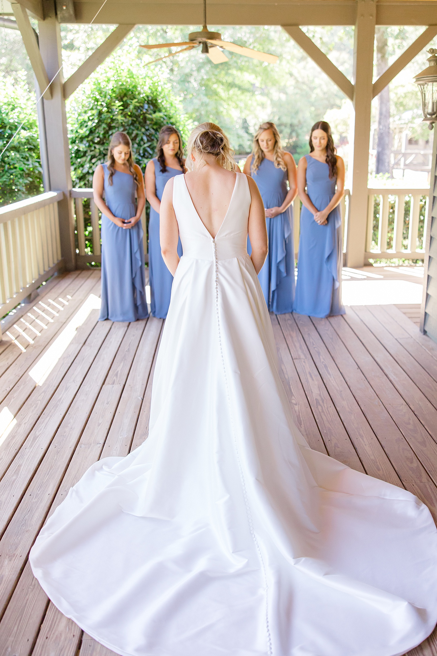 bride first look with bridesmaids before Elegant Windwood Equestrian Wedding 