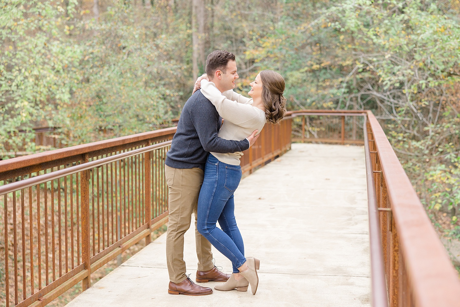 candid engagement portraits during Jemison Trail Engagement in Mountain Brook, Alabama