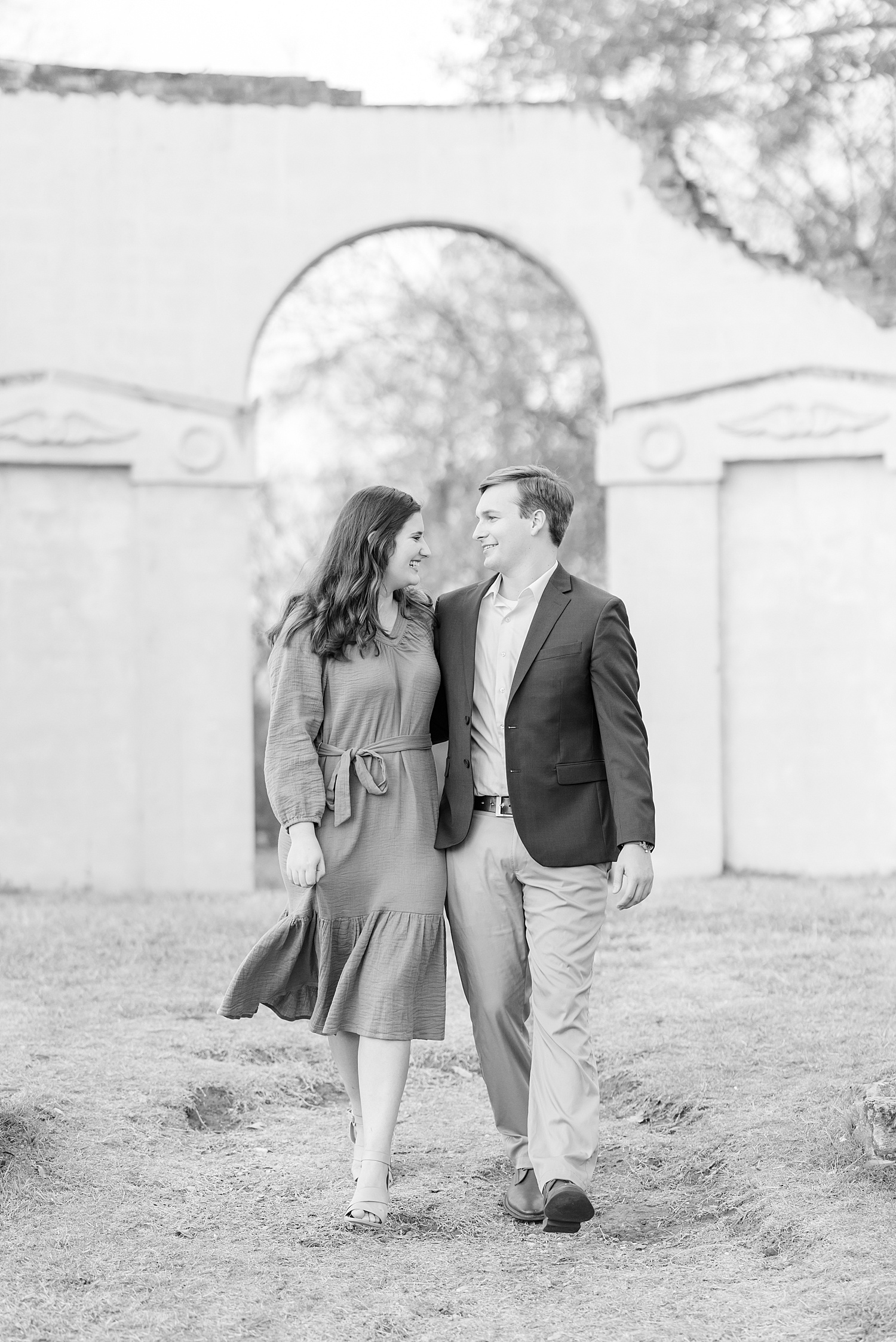 timeless engagement photo of couple walking together 