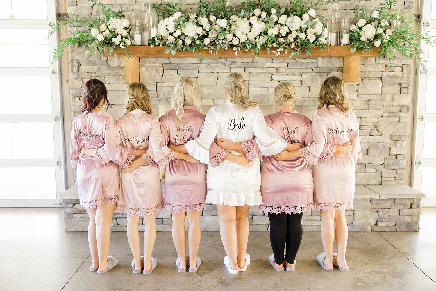 bridesmaids show off their matching personalized robes