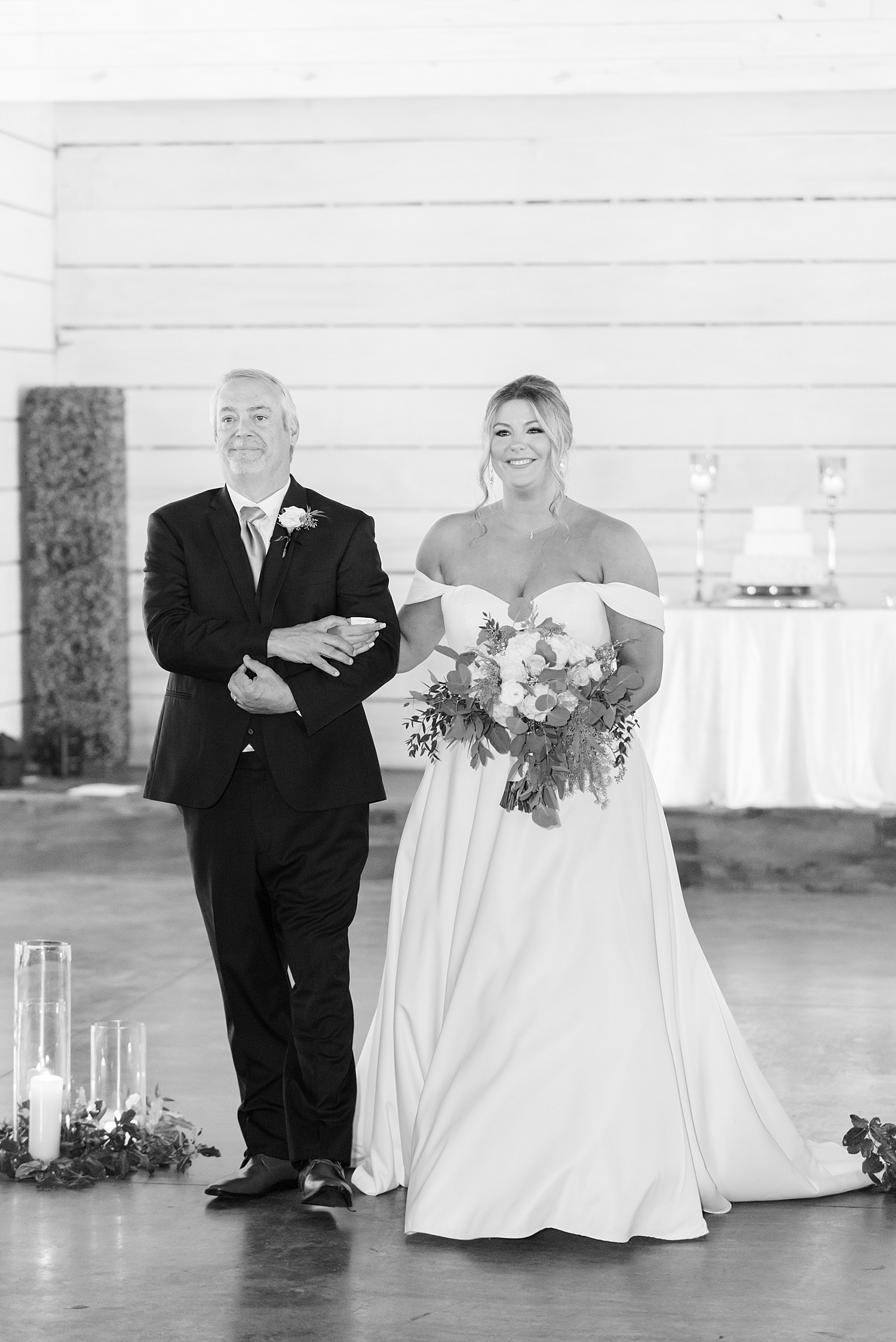 father walks his daughter down the aisle at Mathews Manor Wedding