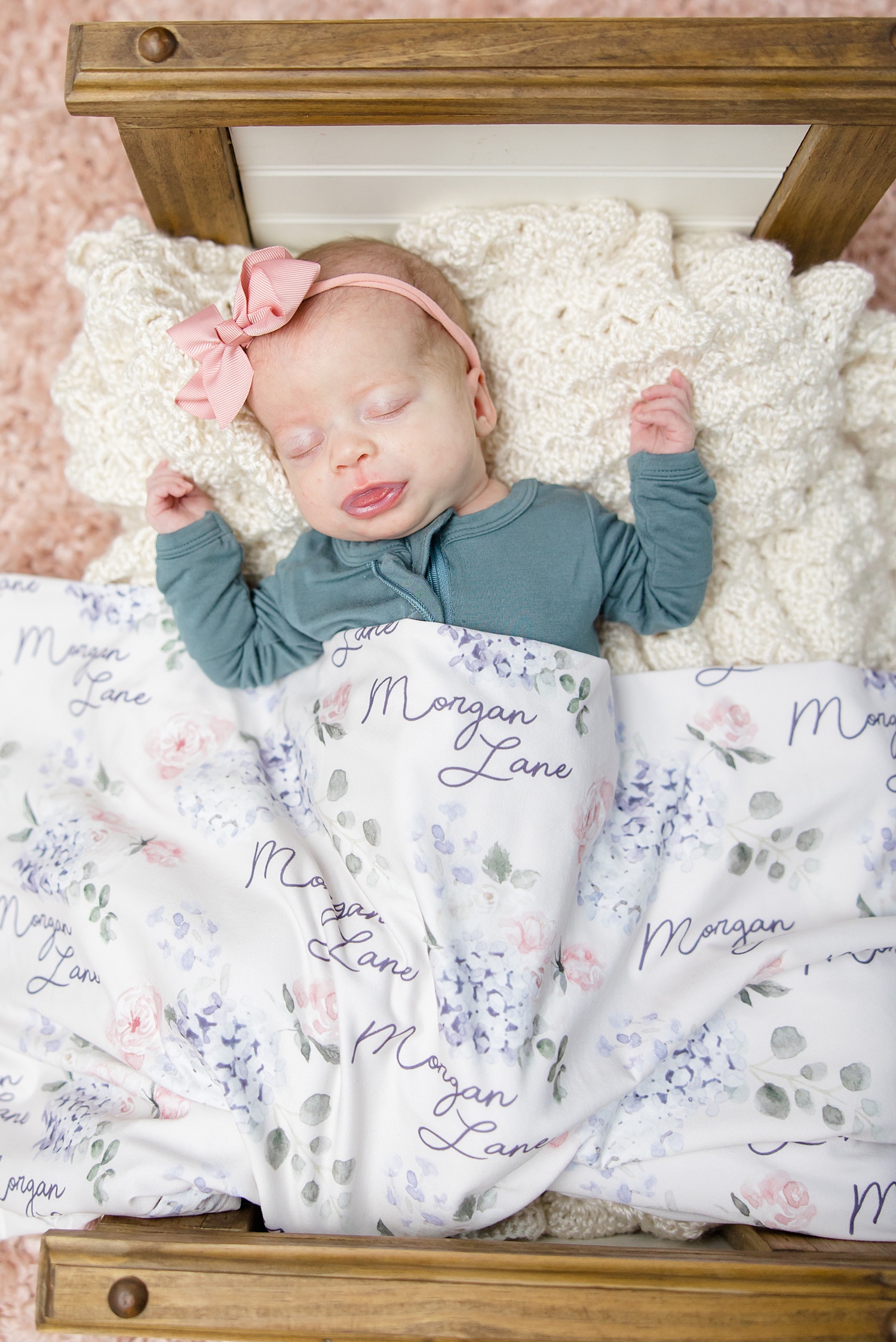 newborn girl sleeps during Birmingham Newborn Session 