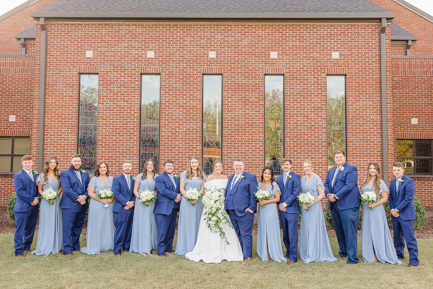 wedding party in navy and dusty blue attire