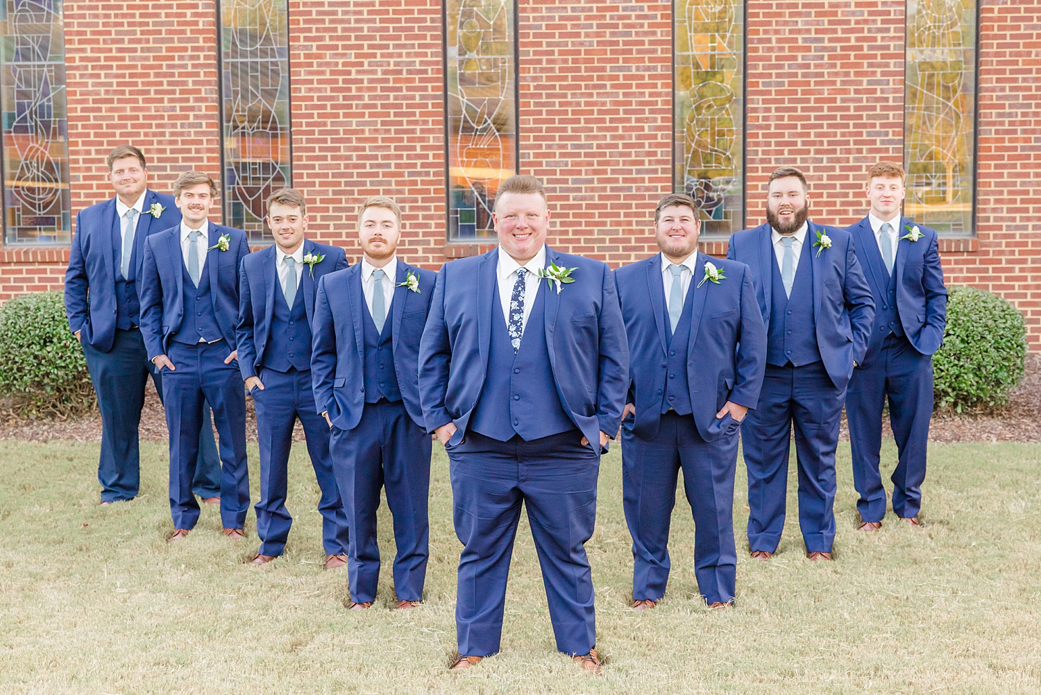 groom and groomsmen in navy suits