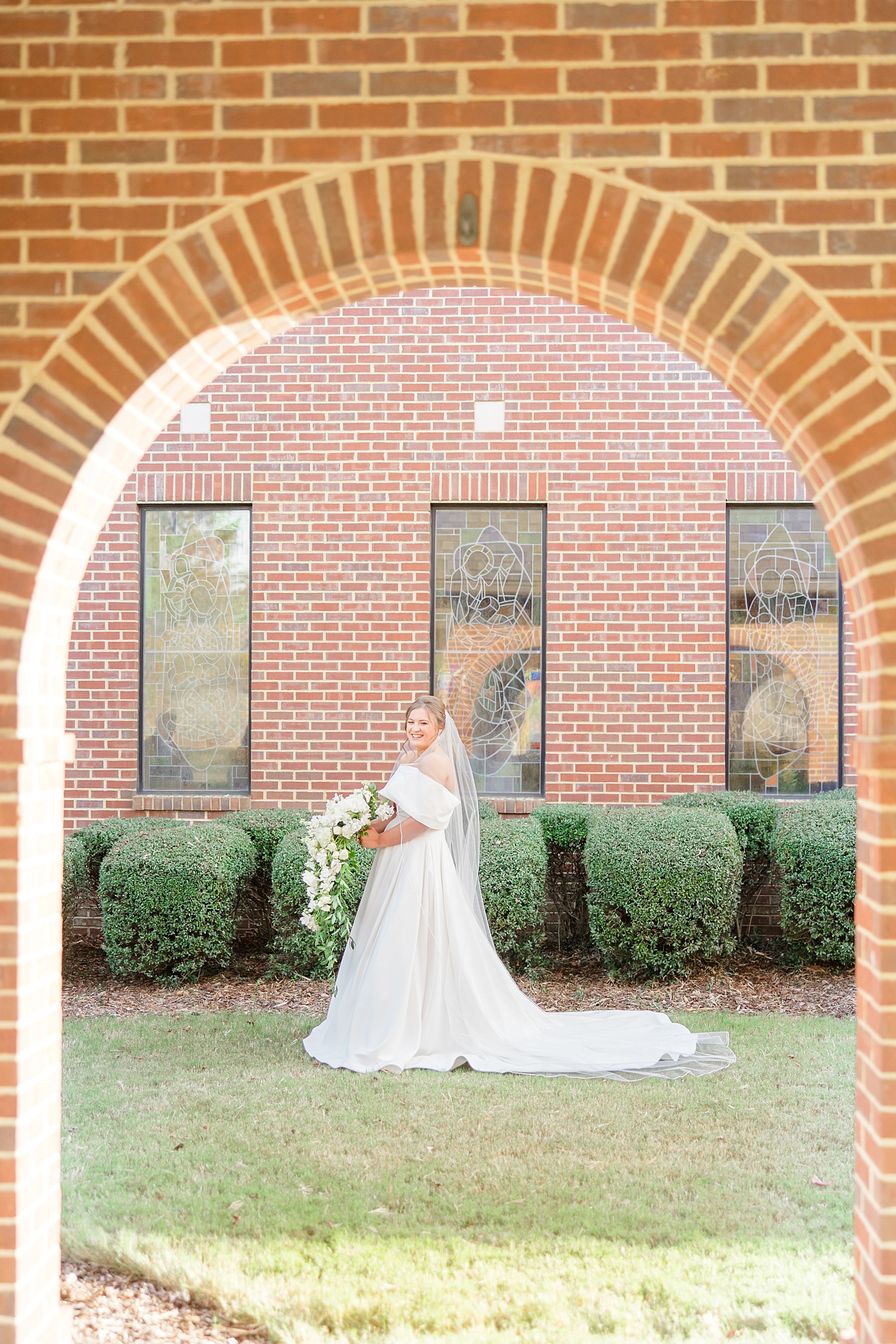 bride portraits through archway