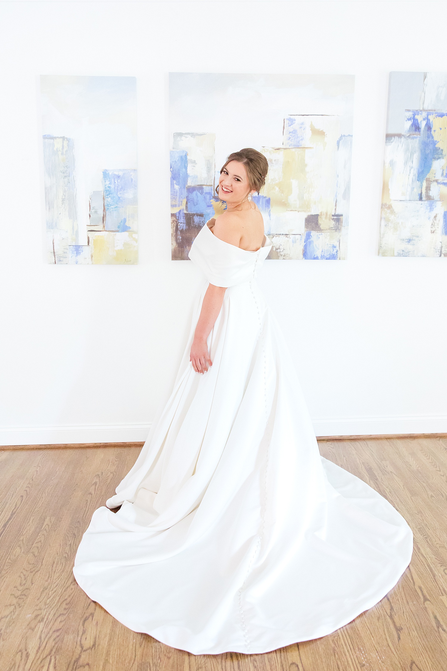 bride in long off-shoulder wedding gown 