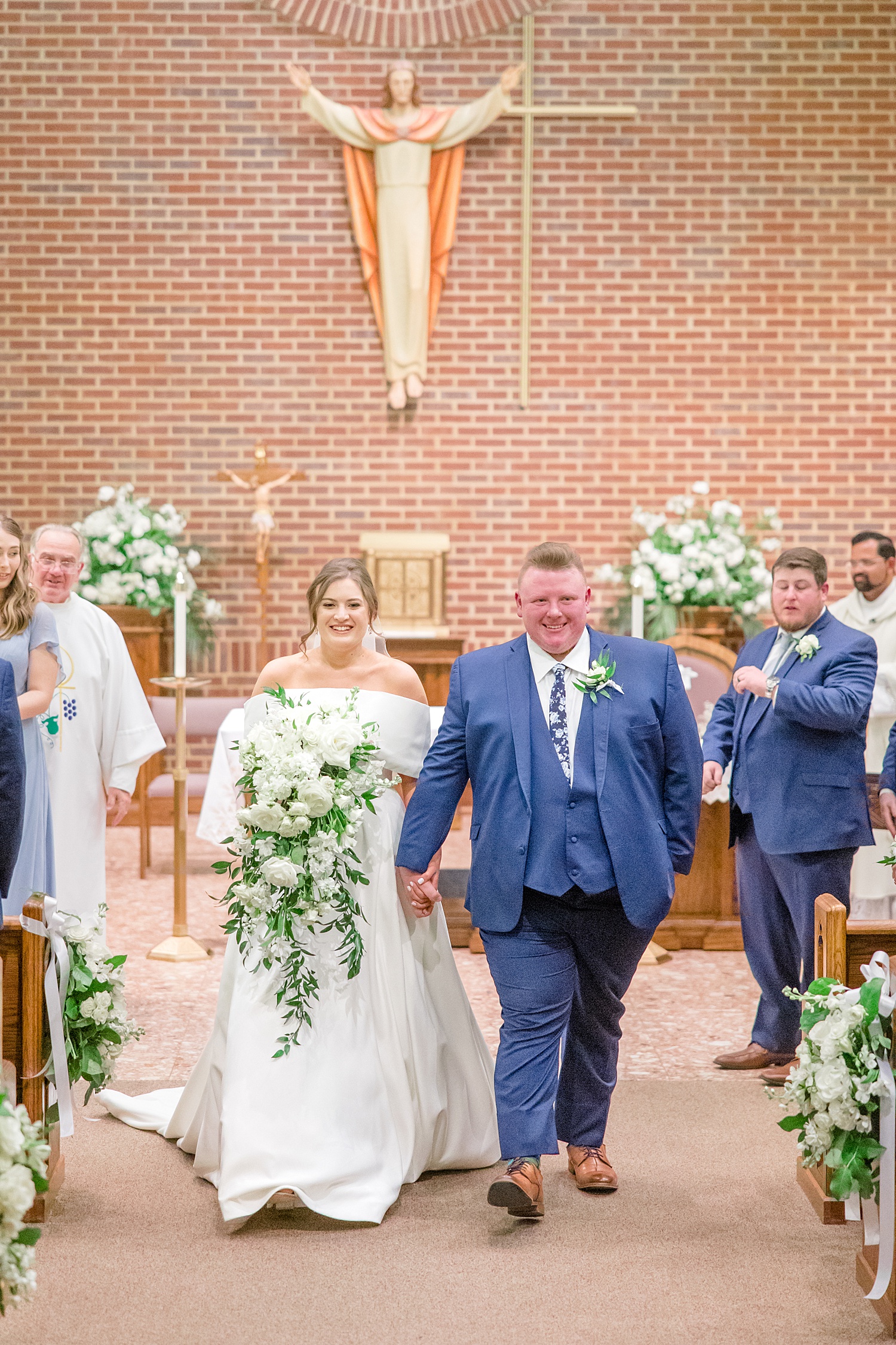 newlyweds exit the church together in Birmingham AL
