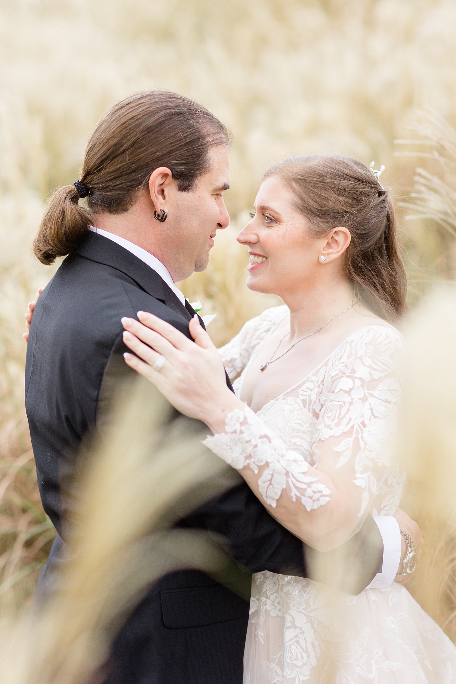 tall grass frames couple during wedding portaits