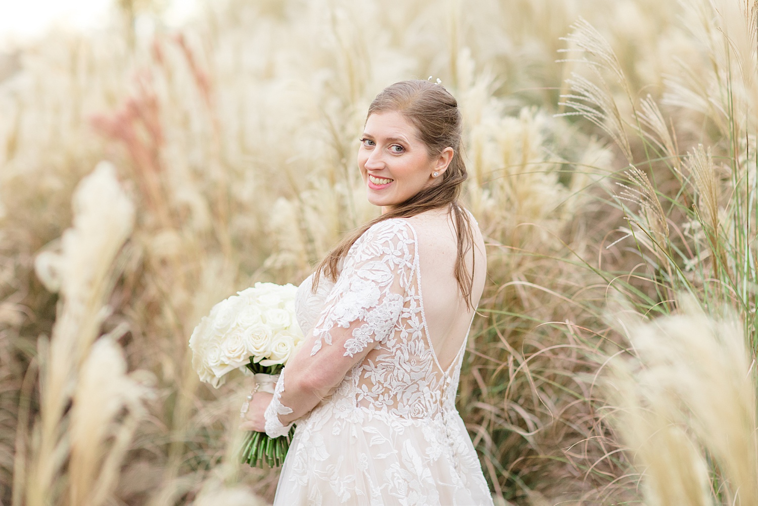 bride in tall grass area at Vestavia, Alabama 