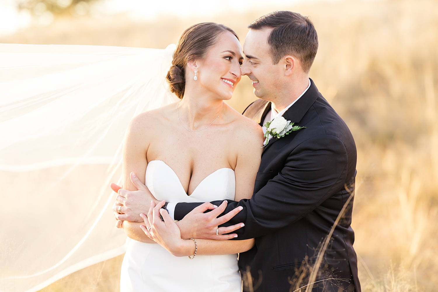 newlyweds embrace in tall grace during wedding portraits