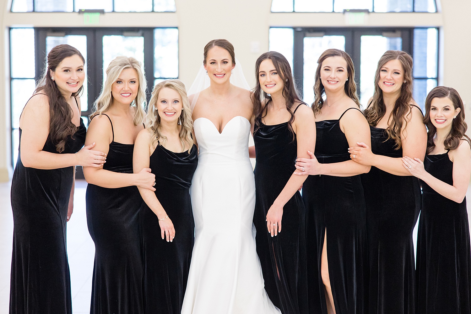 bride and bridesmaids in black dresses from classic and Elegant B&A Warehouse Wedding