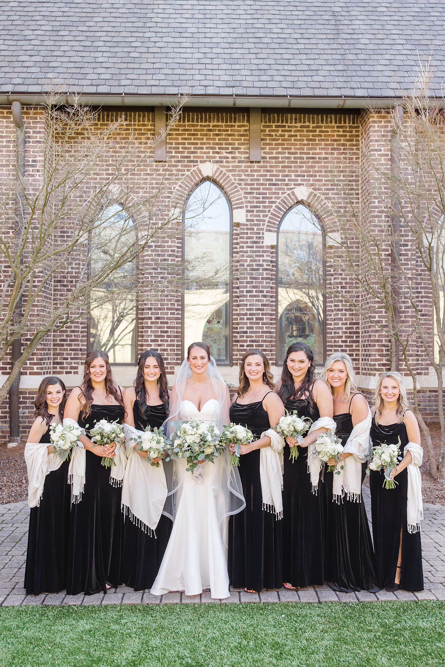 bride with bridesmaids in black dresses 
