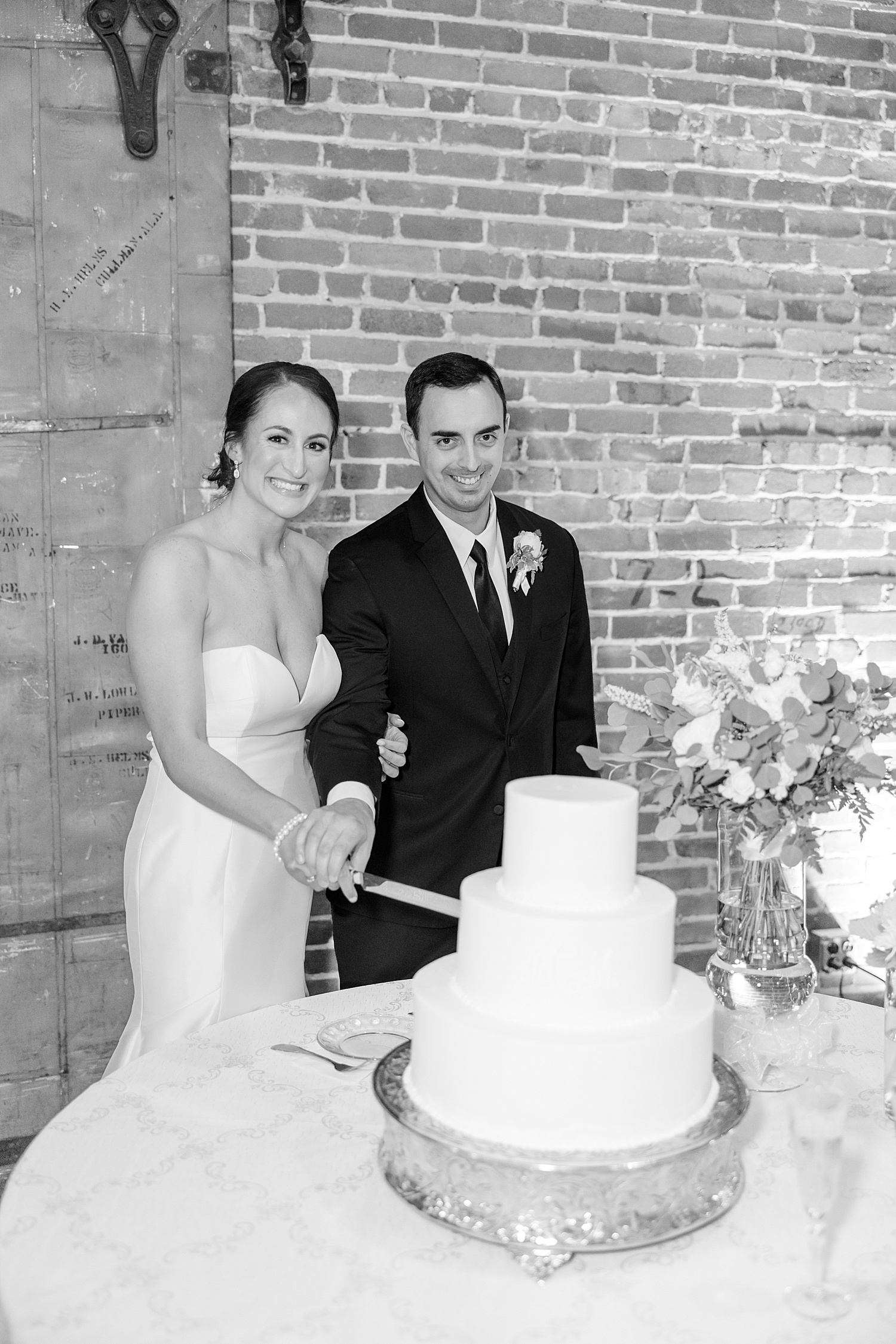 couple cut their wedding cake