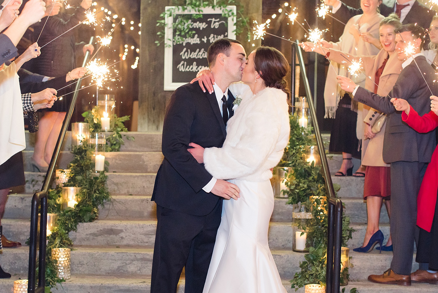 newlyweds kiss during sparkler exit