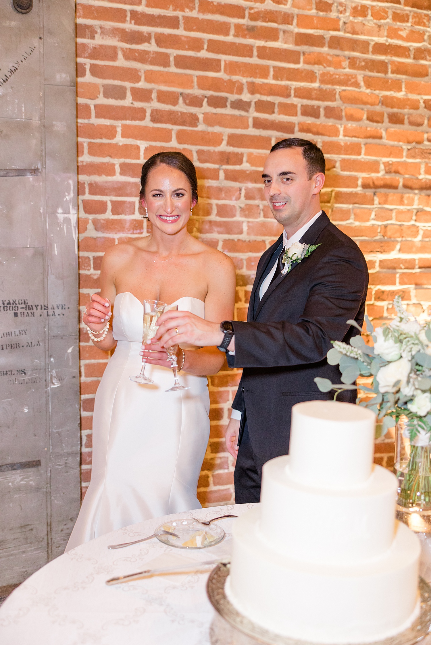 newlyweds toast during wedding reception