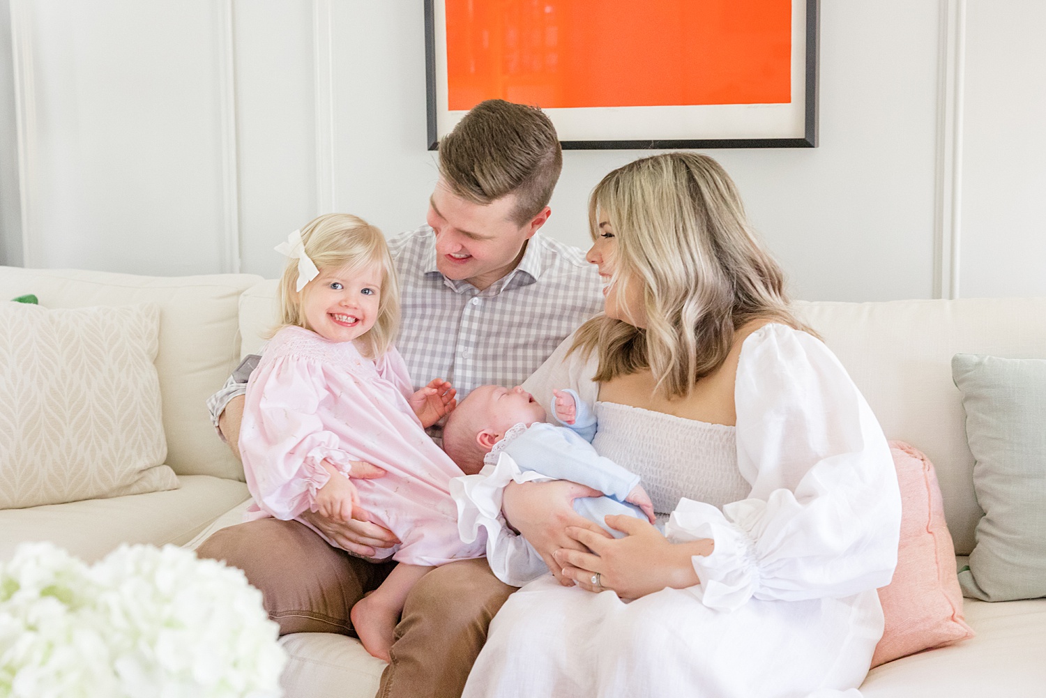 family of four on couch during Mountain Brook Alabama At-Home Newborn Session