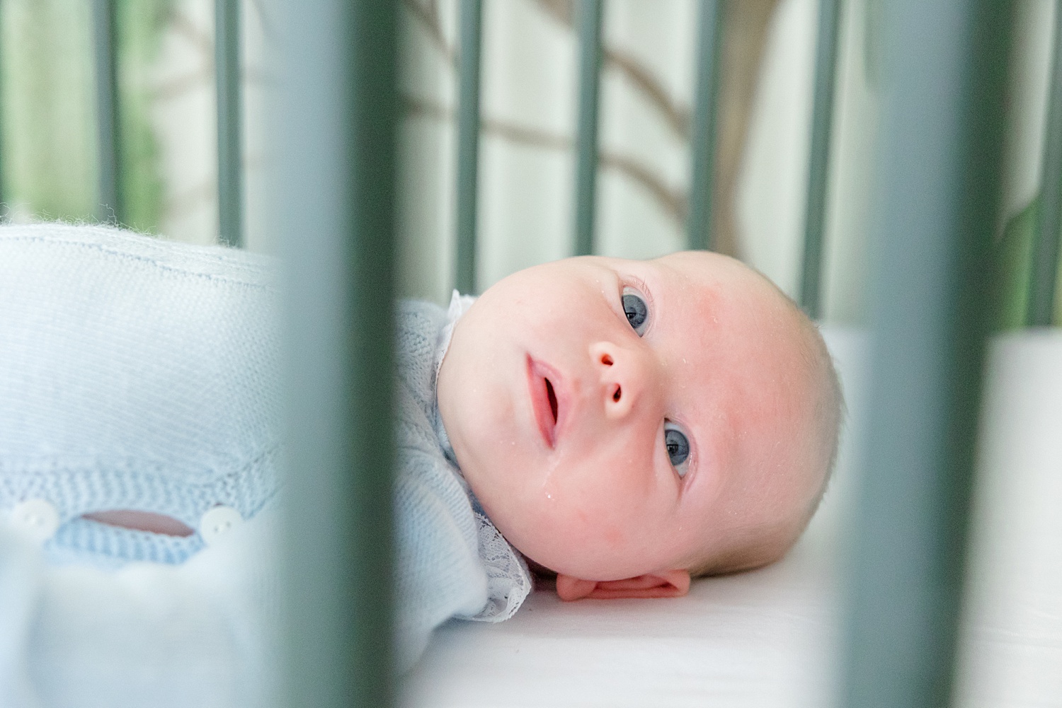 Birmingham newborn photographer captures newborn laying in crib during Mountain Brook Alabama At-Home Newborn Session
