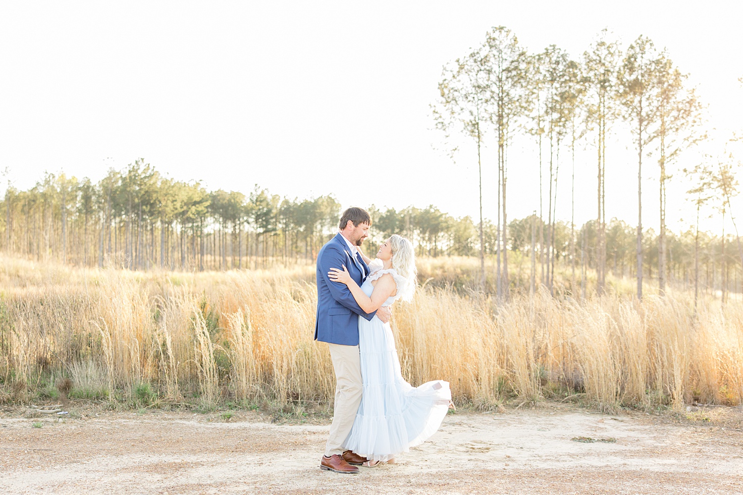 Scenic Birmingham Engagement Session in field of tall grass