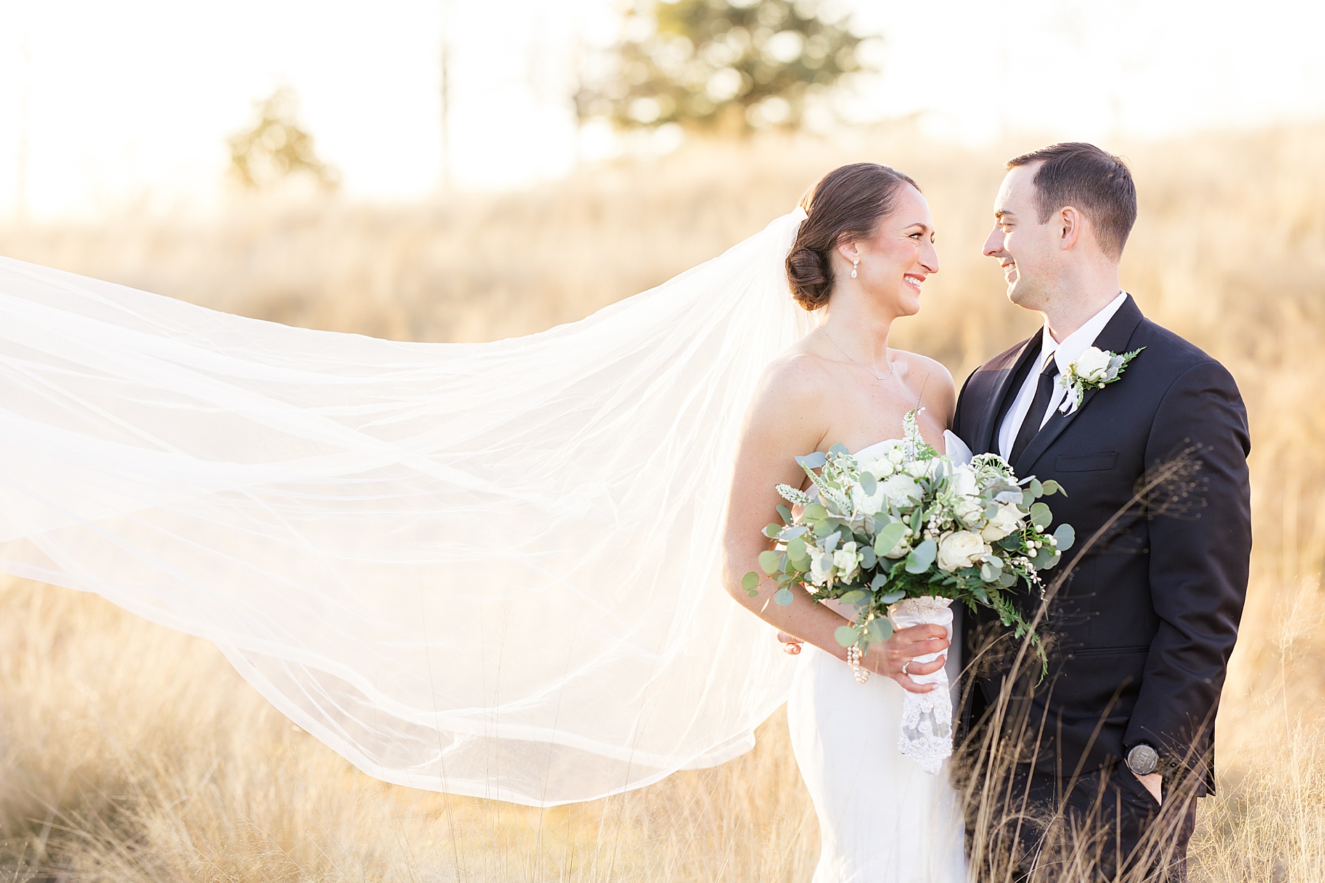 romantic sunset wedding portaits with veil flowing behind me