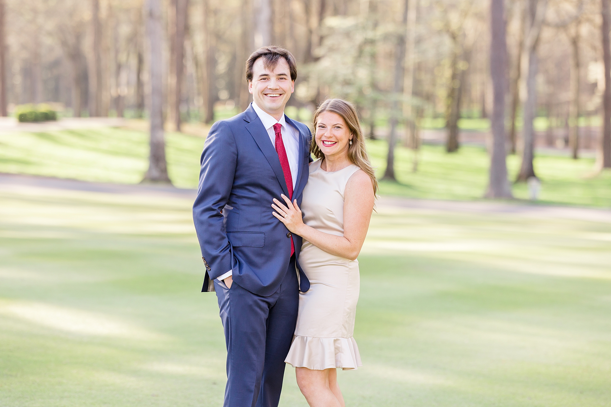 couple on golf course for engagement session