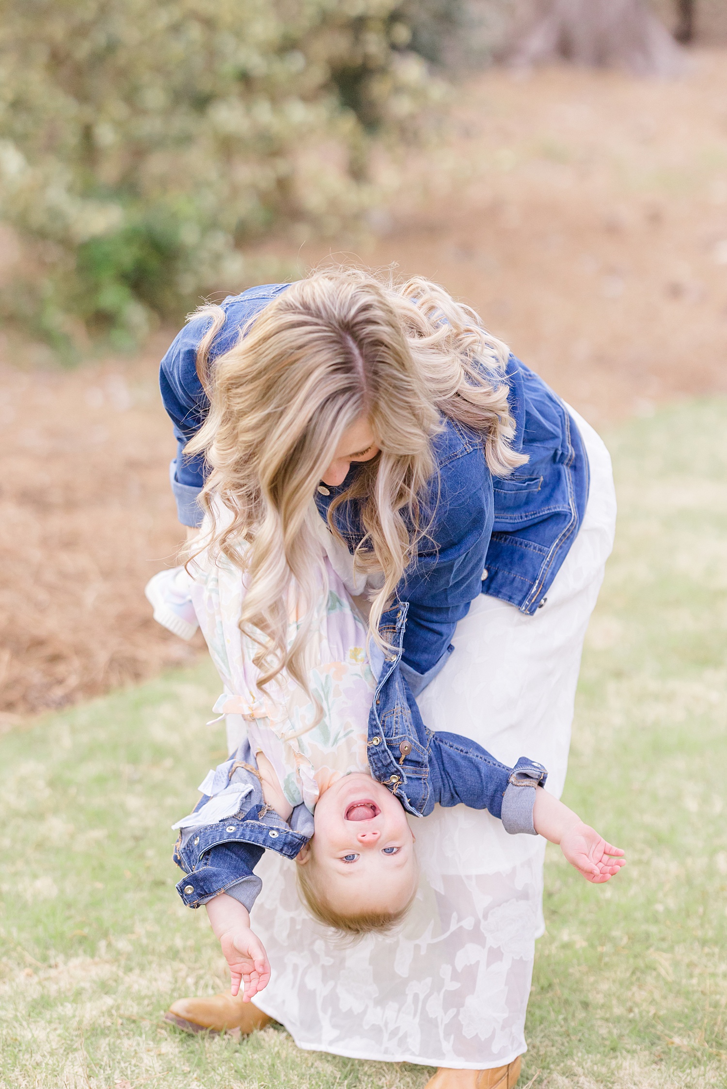 candid moment of mother and daughter during maternity portraits
